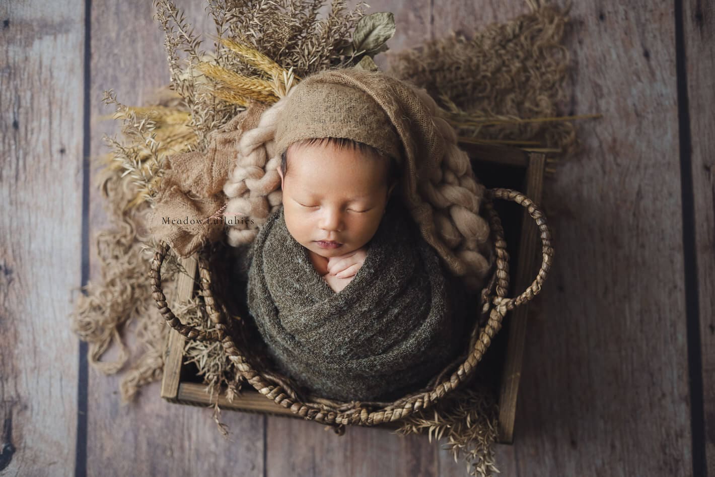 Singapore newborn photography newborn wrapped posing in wooden crate box